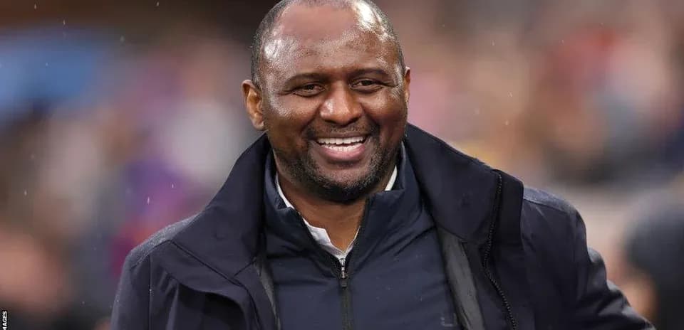 Coach smiling during a football match
