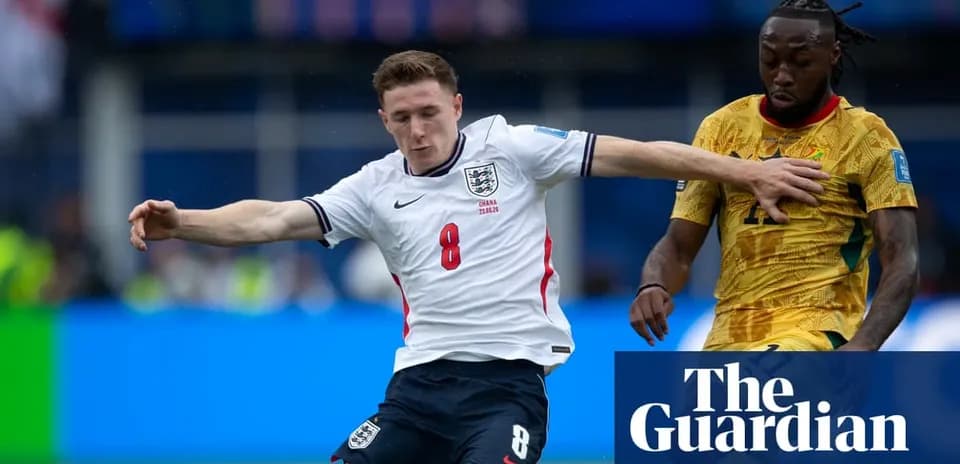 England player challenges Ghana player for the ball
