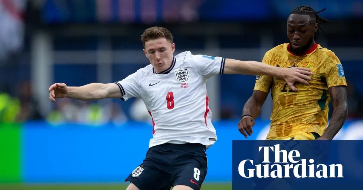 England player challenges Ghana player for the ball