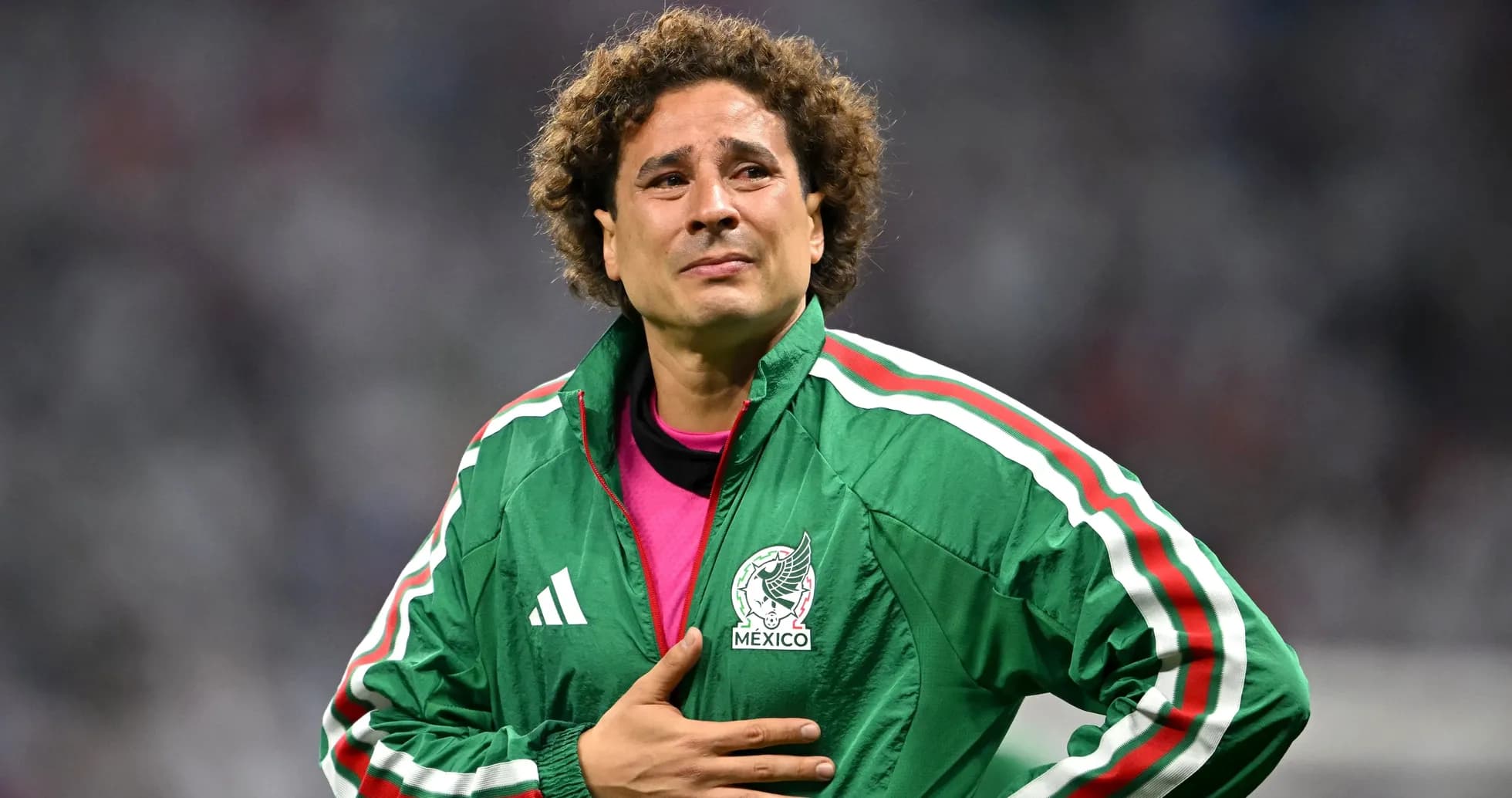 Goalkeeper in green jacket during match