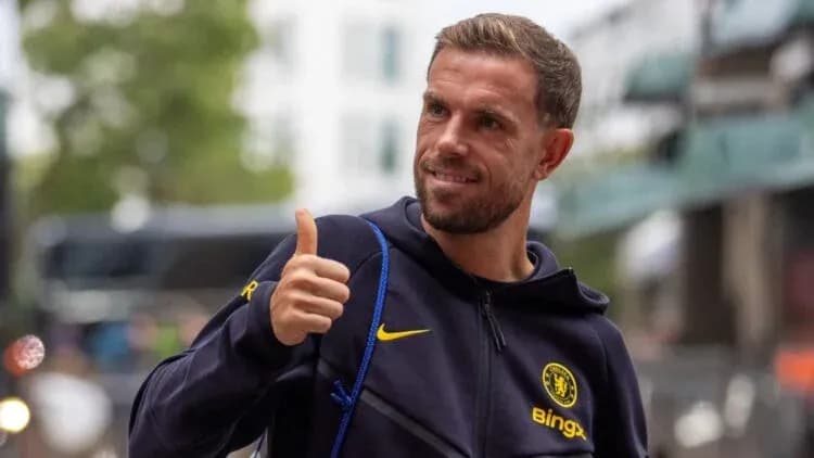 Player giving thumbs up outside Chelsea training facility