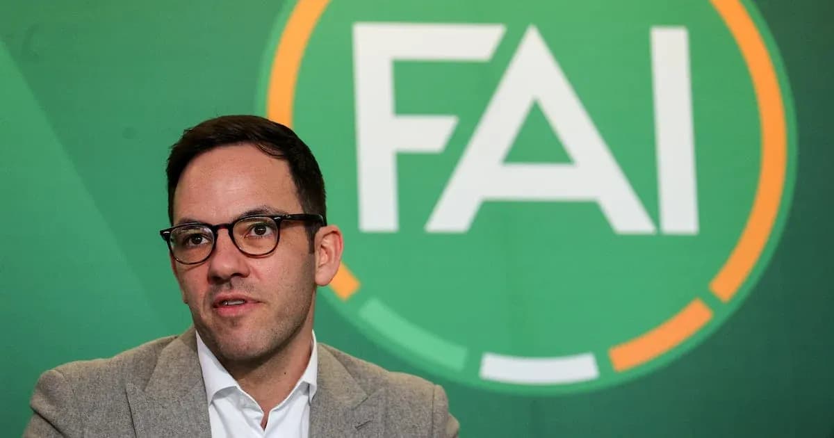 Person speaking at FAI press conference backdrop