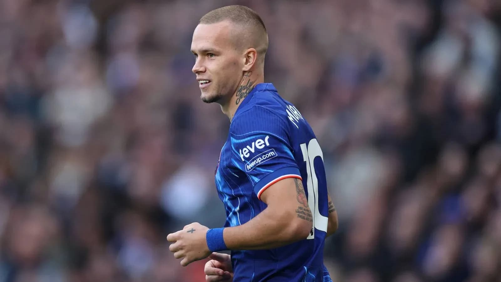 Player wearing blue jersey during match action