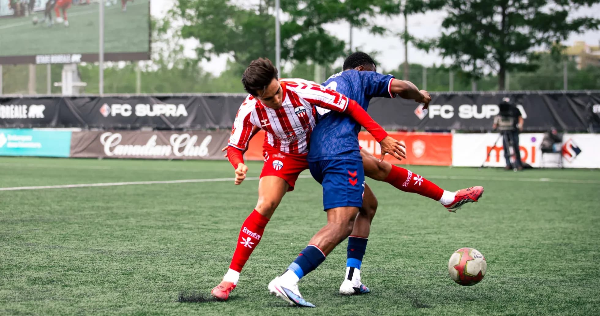 Players competing for the ball during match