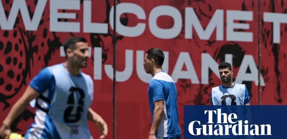 Players training in front of 'Welcome to Tijuana' sign