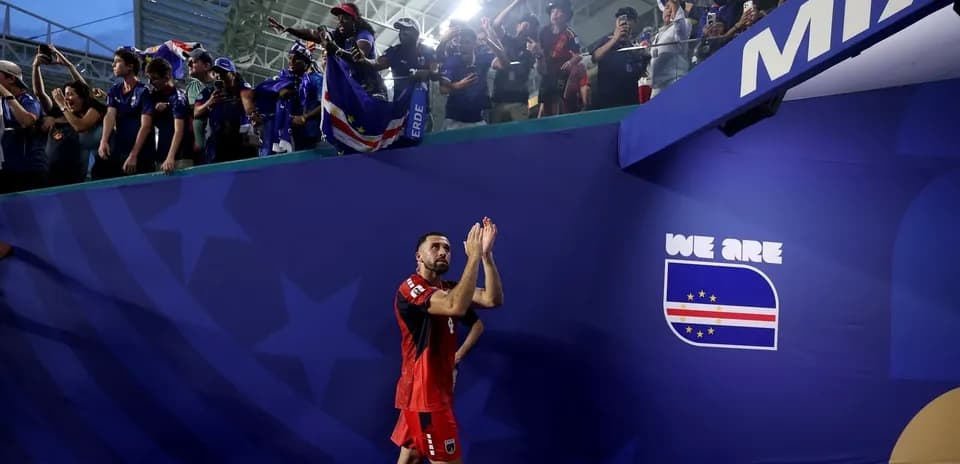 Player applauding fans after match at stadium