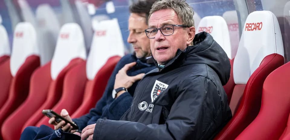 Coaches sitting on bench during a match