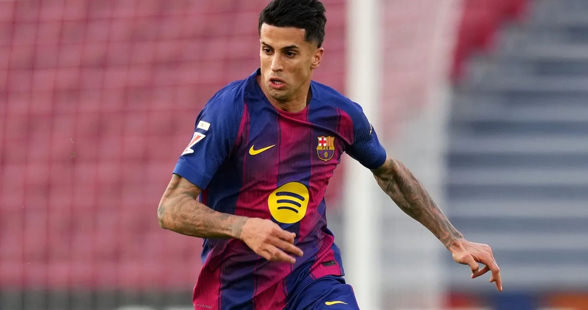 Player in Barcelona kit running with the ball