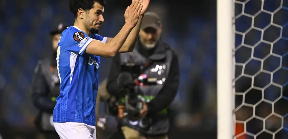 Player applauding fans after match at stadium