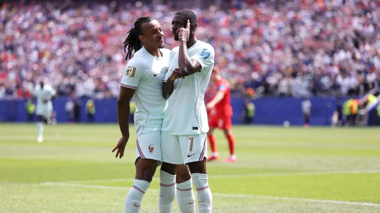 Two players celebrating a goal on the field