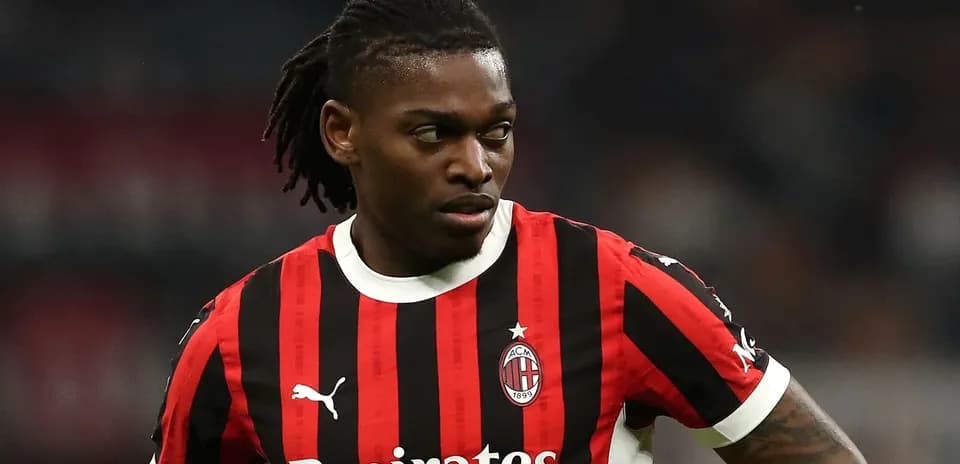 Player in AC Milan jersey on the field
