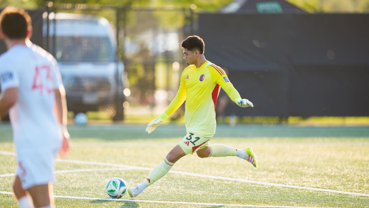 Goalkeeper kicking ball during match