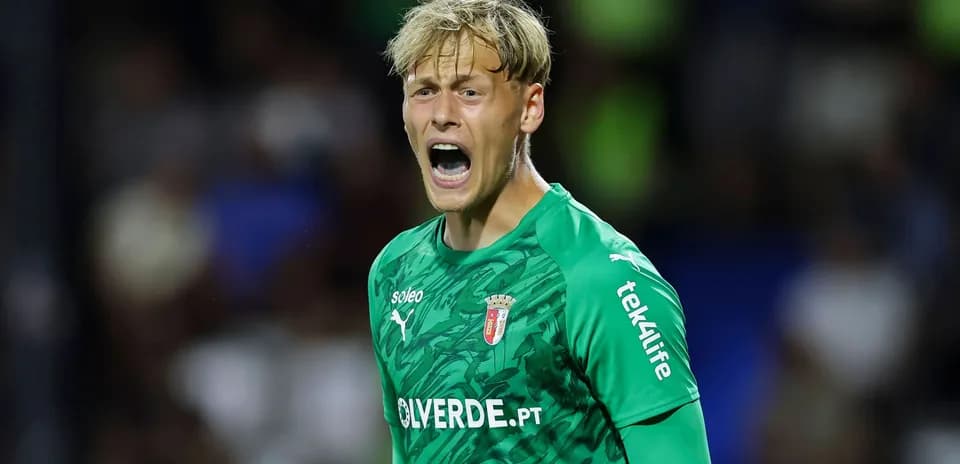 Goalkeeper yelling during a match in green jersey