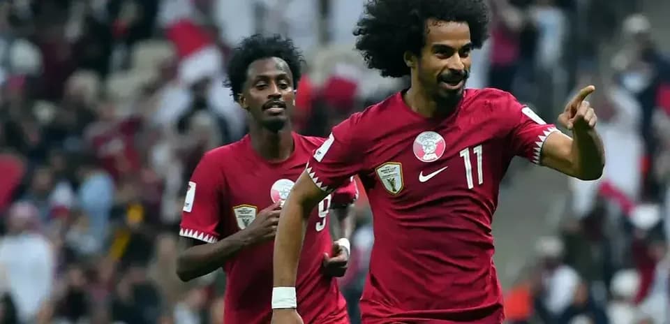 Qatar players celebrating a goal during match