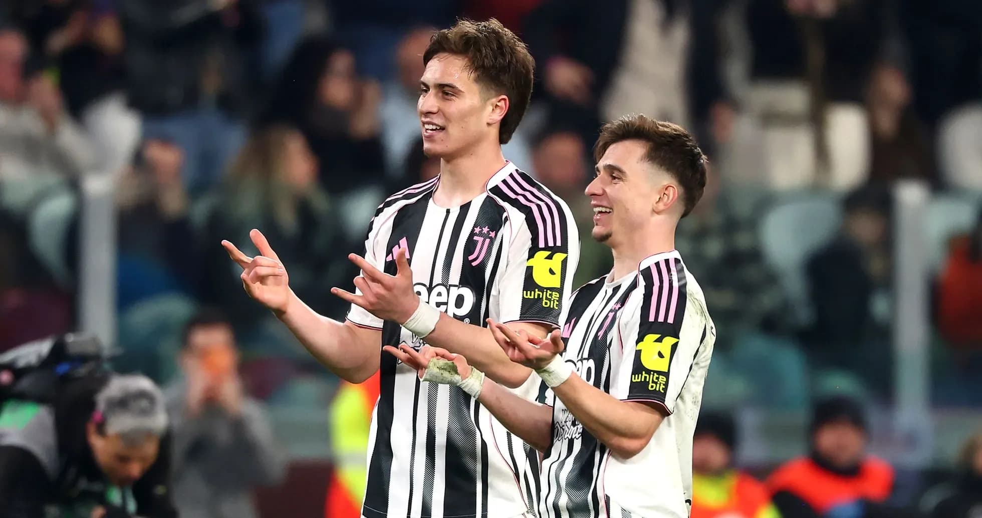 Two Juventus players celebrating during a match