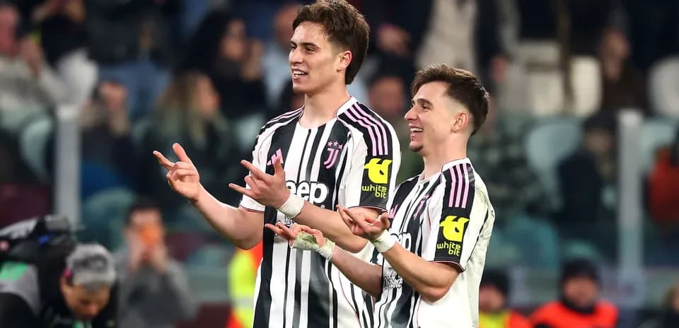 Two Juventus players celebrating during a match
