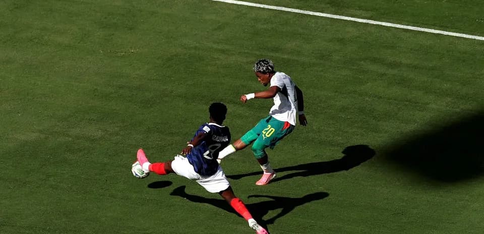 Player tackling opponent during a soccer match