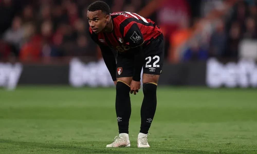 AFC Bournemouth player bending forward on the pitch