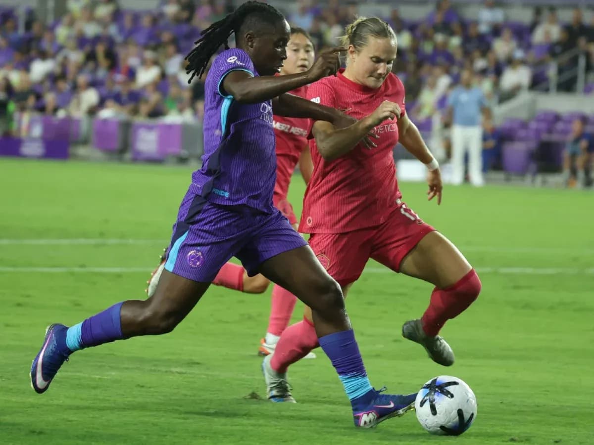 Two players competing for the ball in match