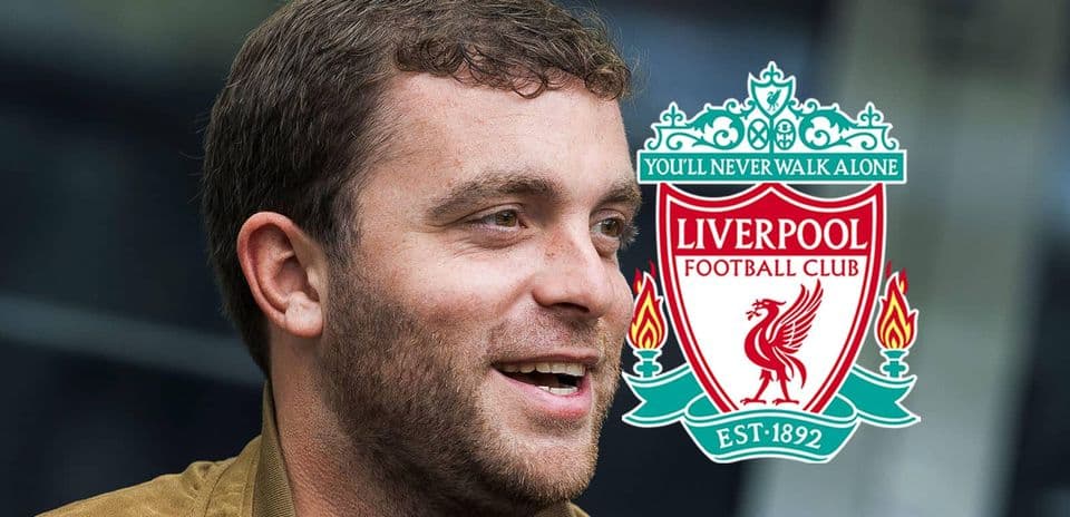 Person smiling with Liverpool FC logo in background