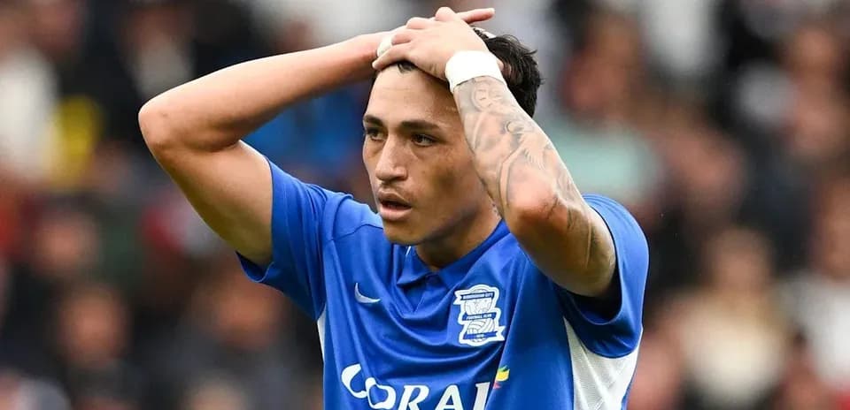 Birmingham City player holding head in frustration