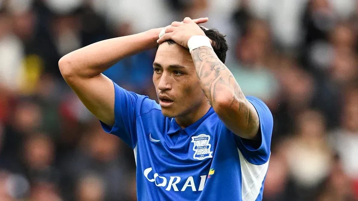 Birmingham City player holding head in frustration