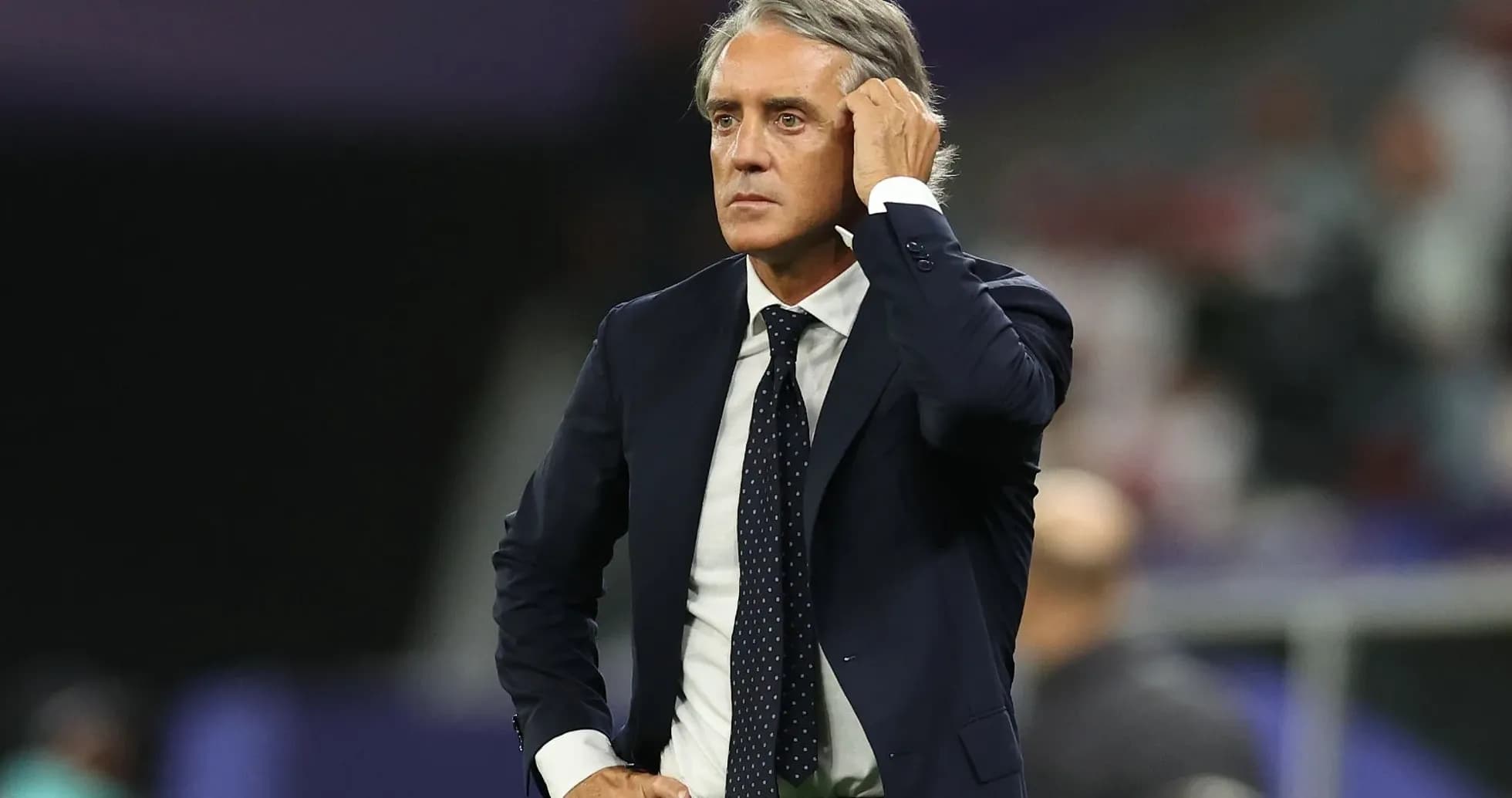 Coach observing the match from the sideline