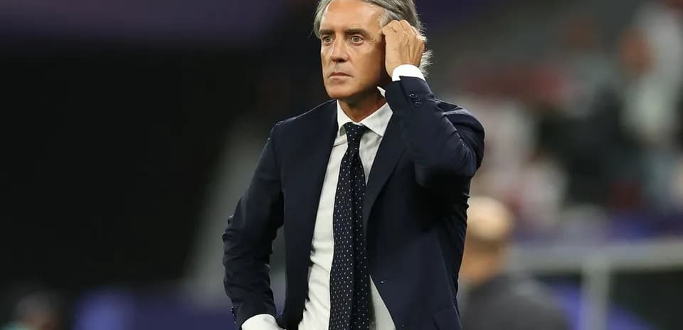 Coach observing the match from the sideline
