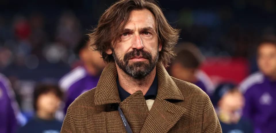 Coach in a brown coat at a sports event