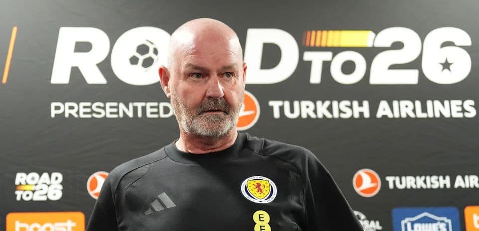 Scotland coach at press conference backdrop