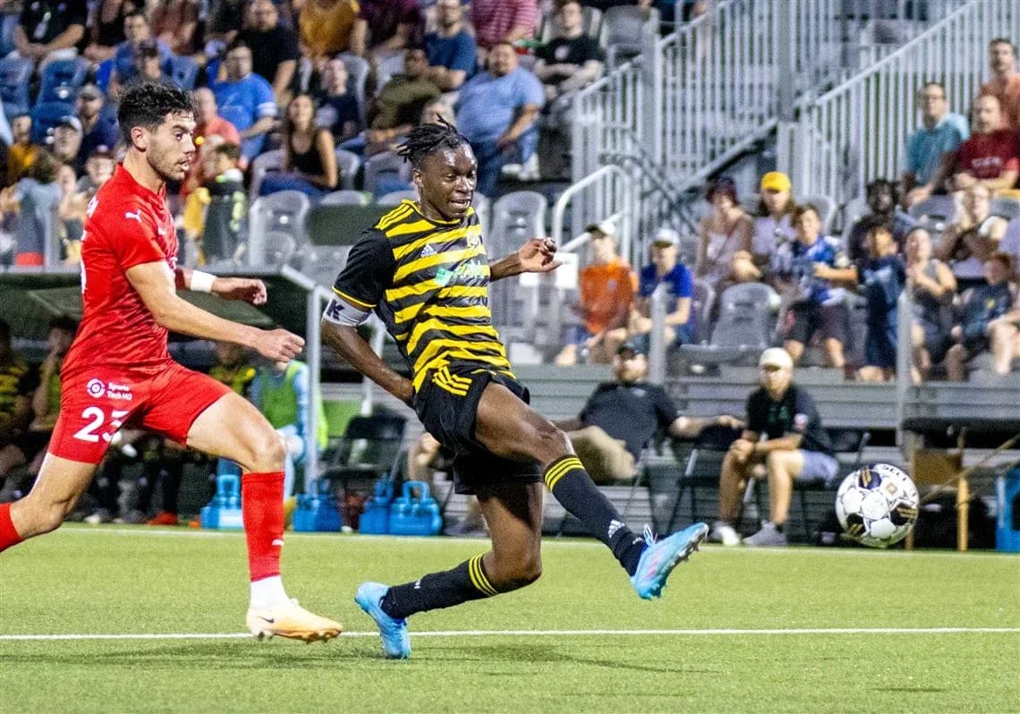 Pittsburgh Riverhounds player kicking the ball