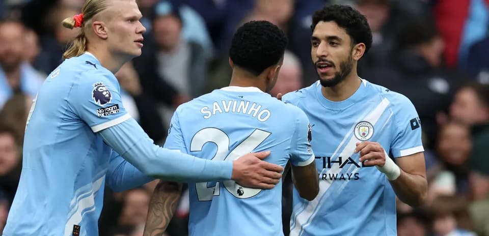 Manchester City players celebrating during a match