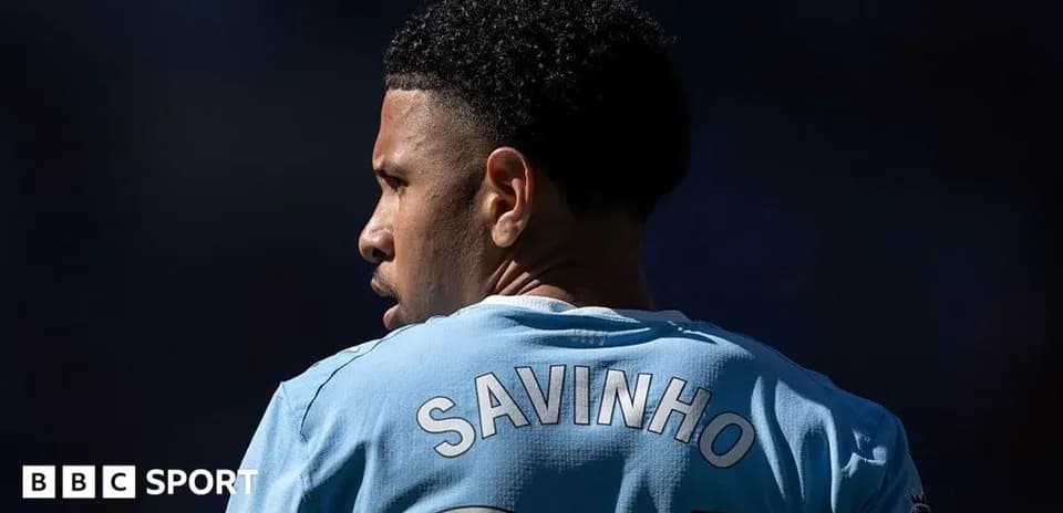 Player wearing blue jersey with 'SAVINHO' on back