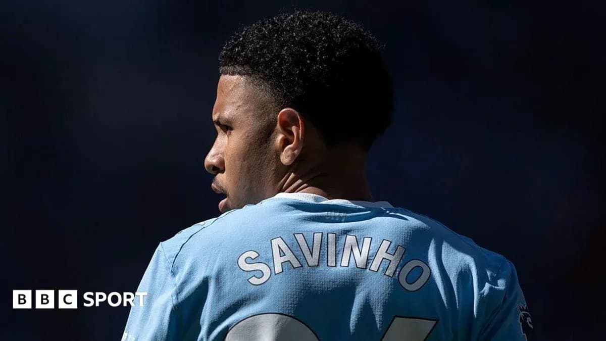 Player wearing blue jersey with 'SAVINHO' on back