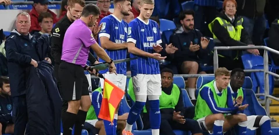 Substitute preparing to enter match at stadium