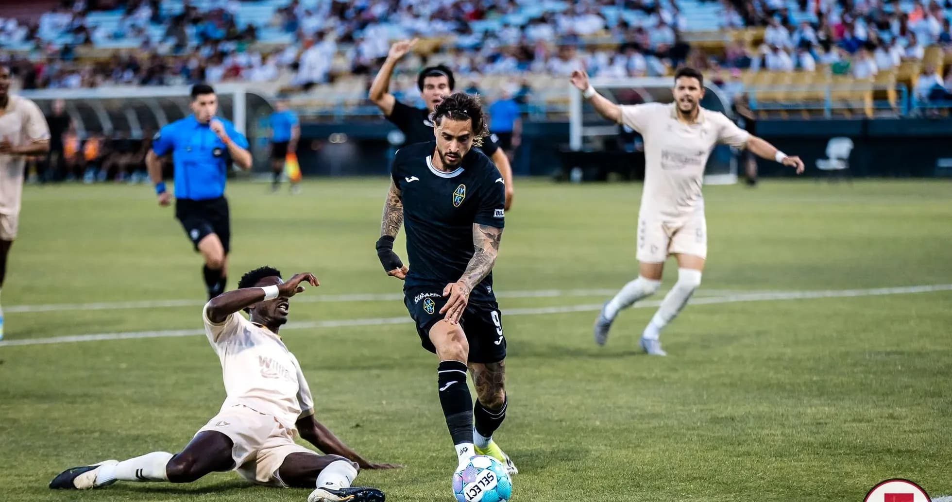Las Vegas Lights player evading tackle during match