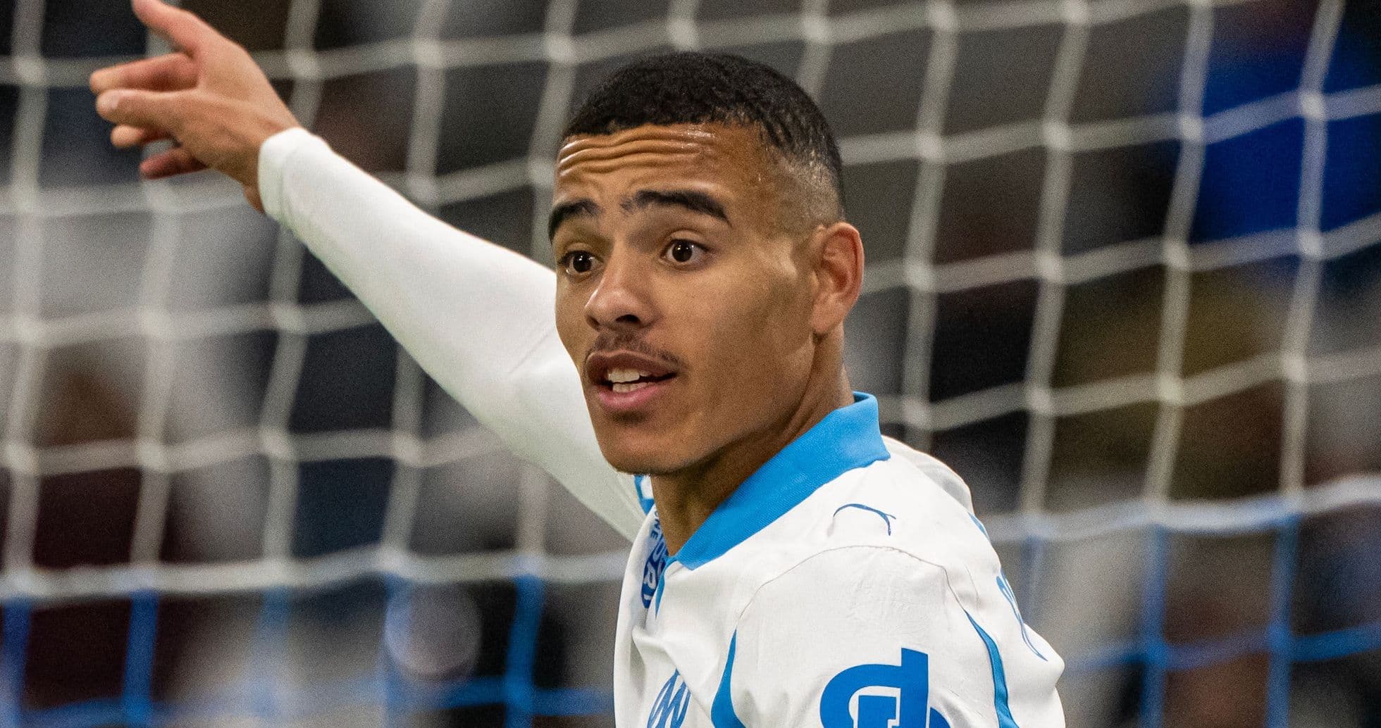 Player celebrating a goal in Marseille jersey