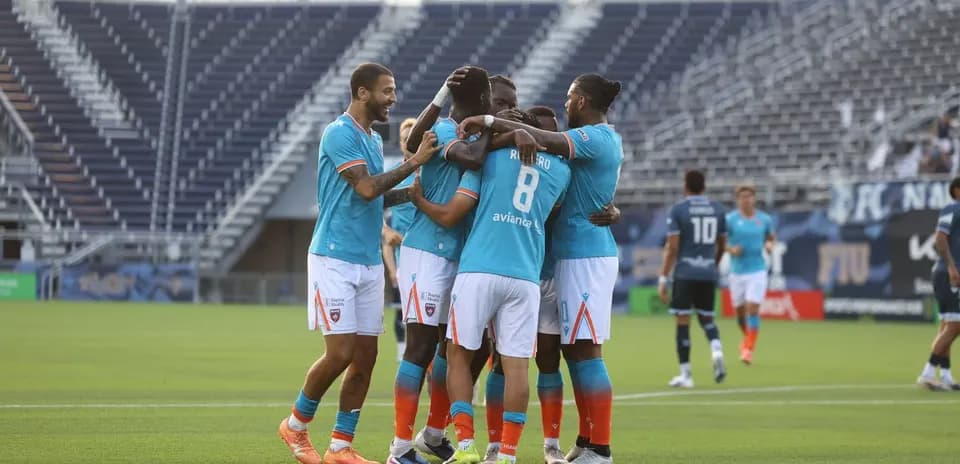 Miami FC players celebrating a goal