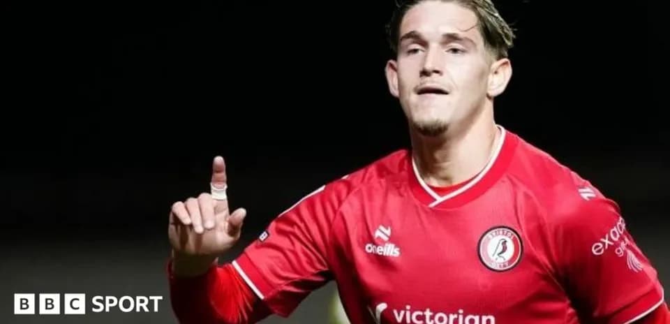 Player celebrating goal in red team jersey