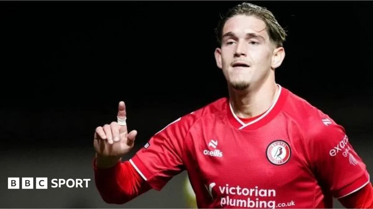 Player celebrating goal in red team jersey