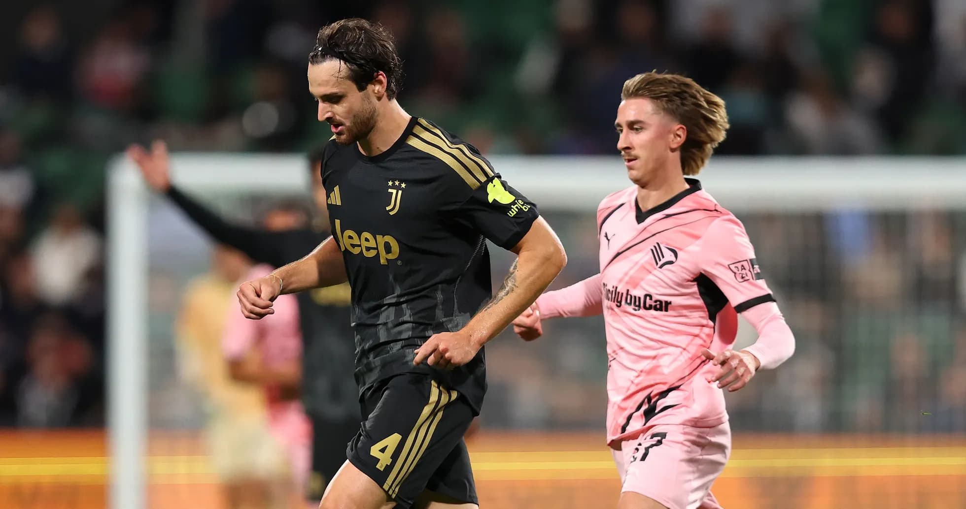 Juventus player running during match against Swansea
