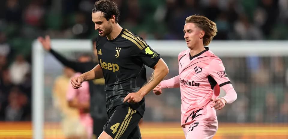 Juventus player running during match against Swansea
