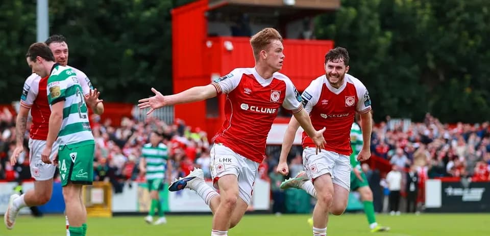 Player celebrating goal with teammates during match