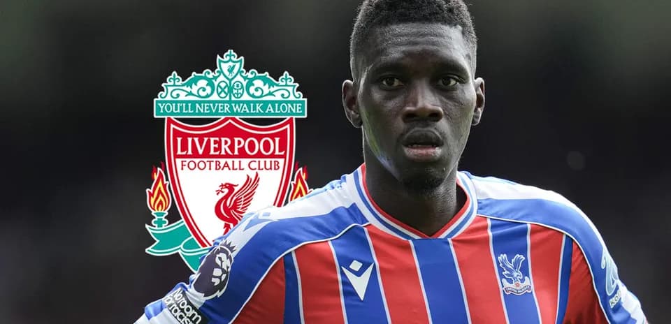 Crystal Palace player with Liverpool logo in background