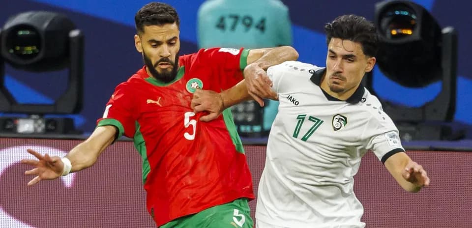 Two players contesting for the ball during match