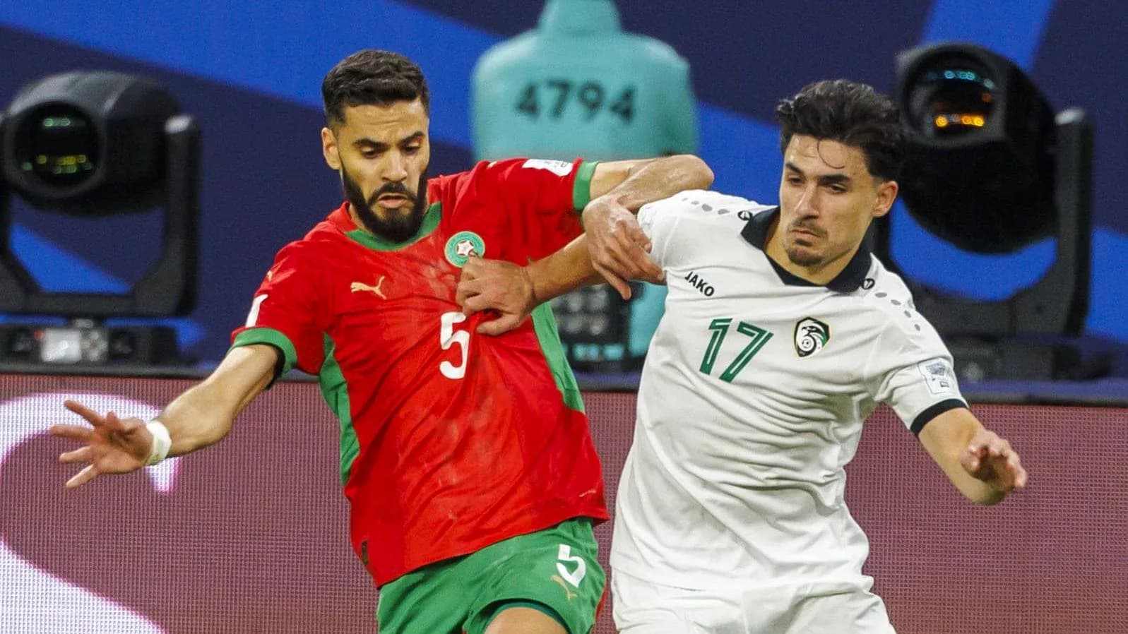 Two players contesting for the ball during match