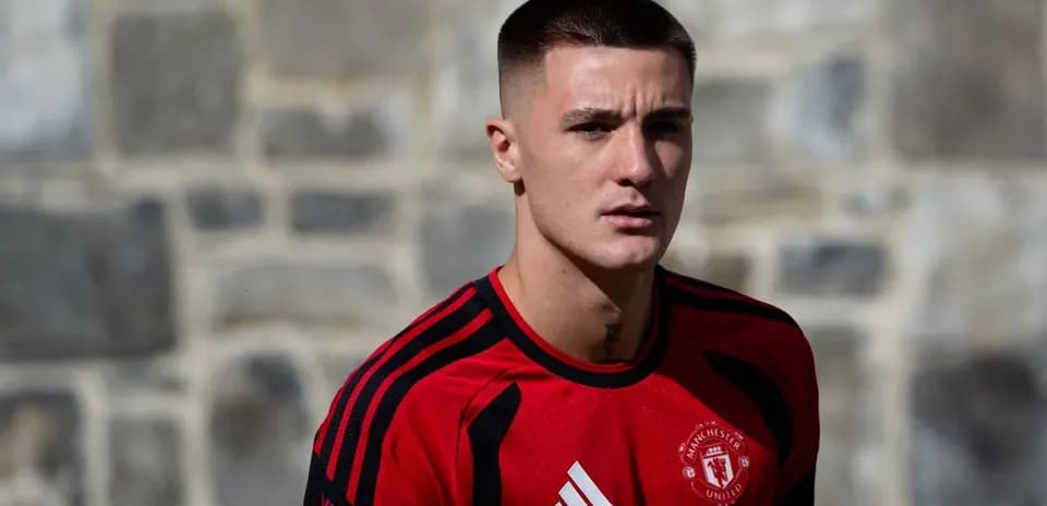 Player in red training kit at outdoor session