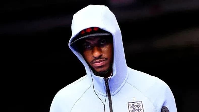 Player wearing a hoodie before the match
