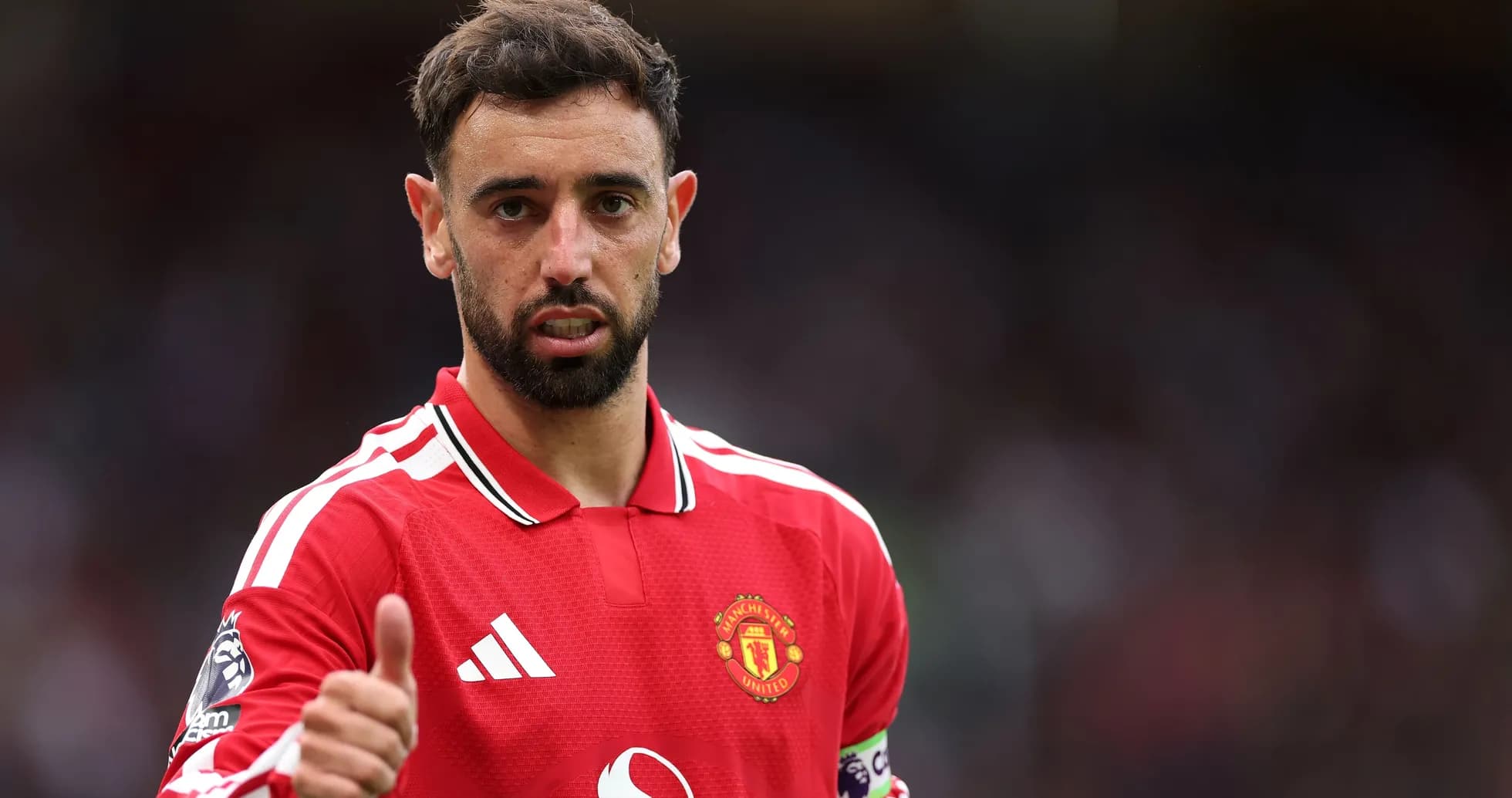 Bruno Fernandes giving a thumbs up on pitch