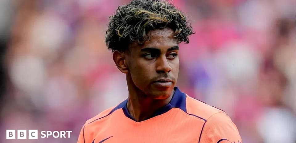 Player in orange Barcelona kit during match